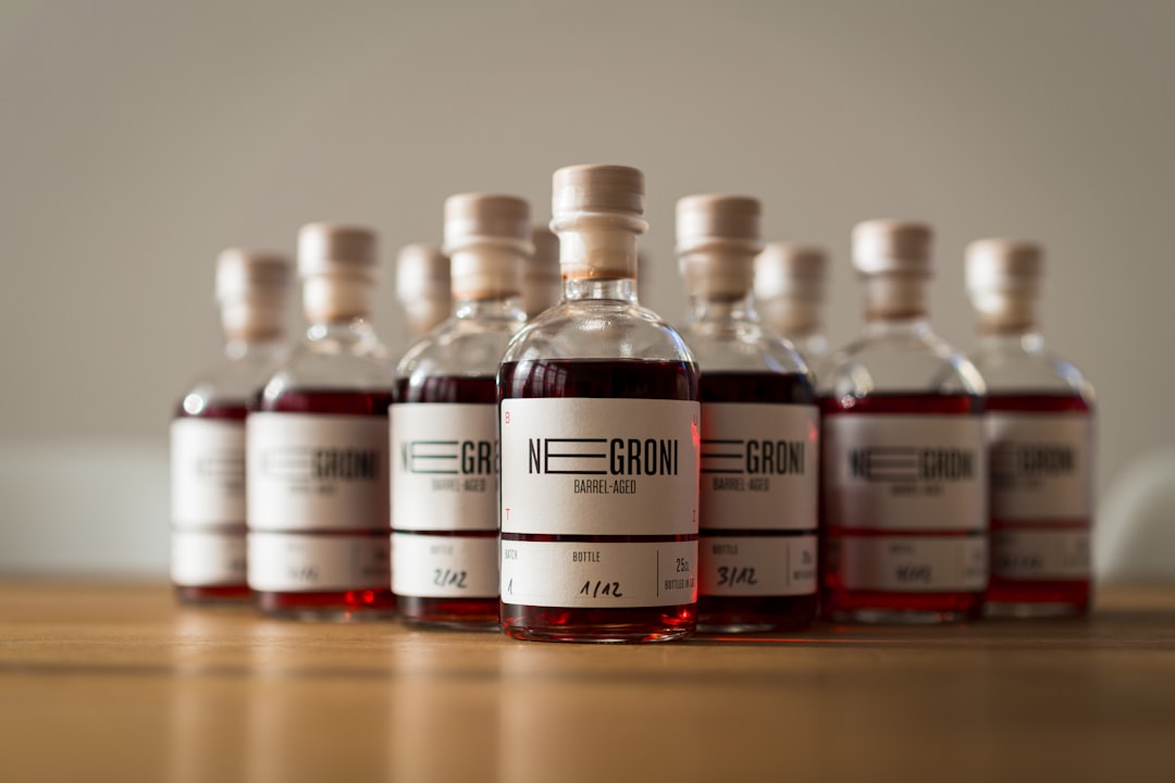 clear glass bottles on brown wooden table