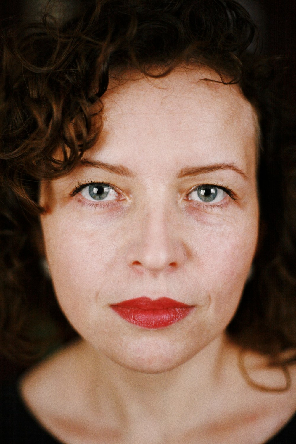 woman with red lipstick and brown hair