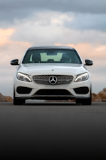 white mercedes benz car on road during daytime