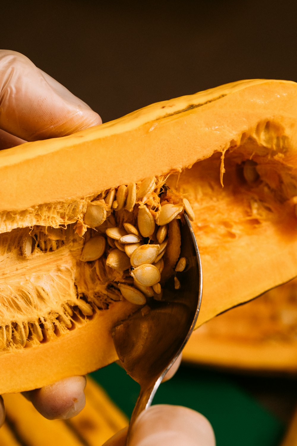 person holding sliced of yellow cheese