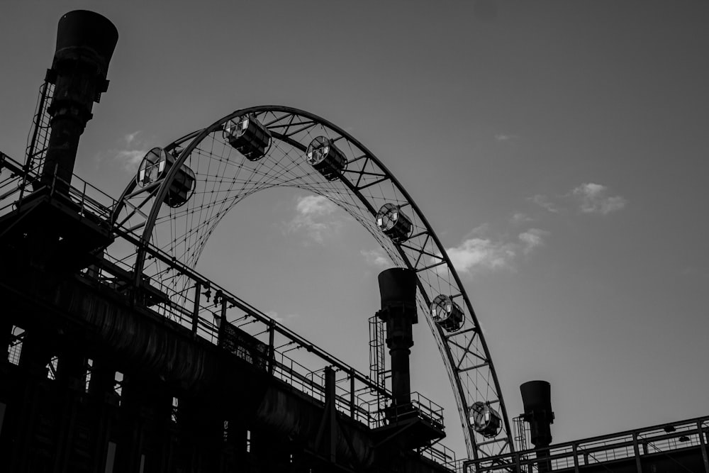grayscale photo of roller coaster rail
