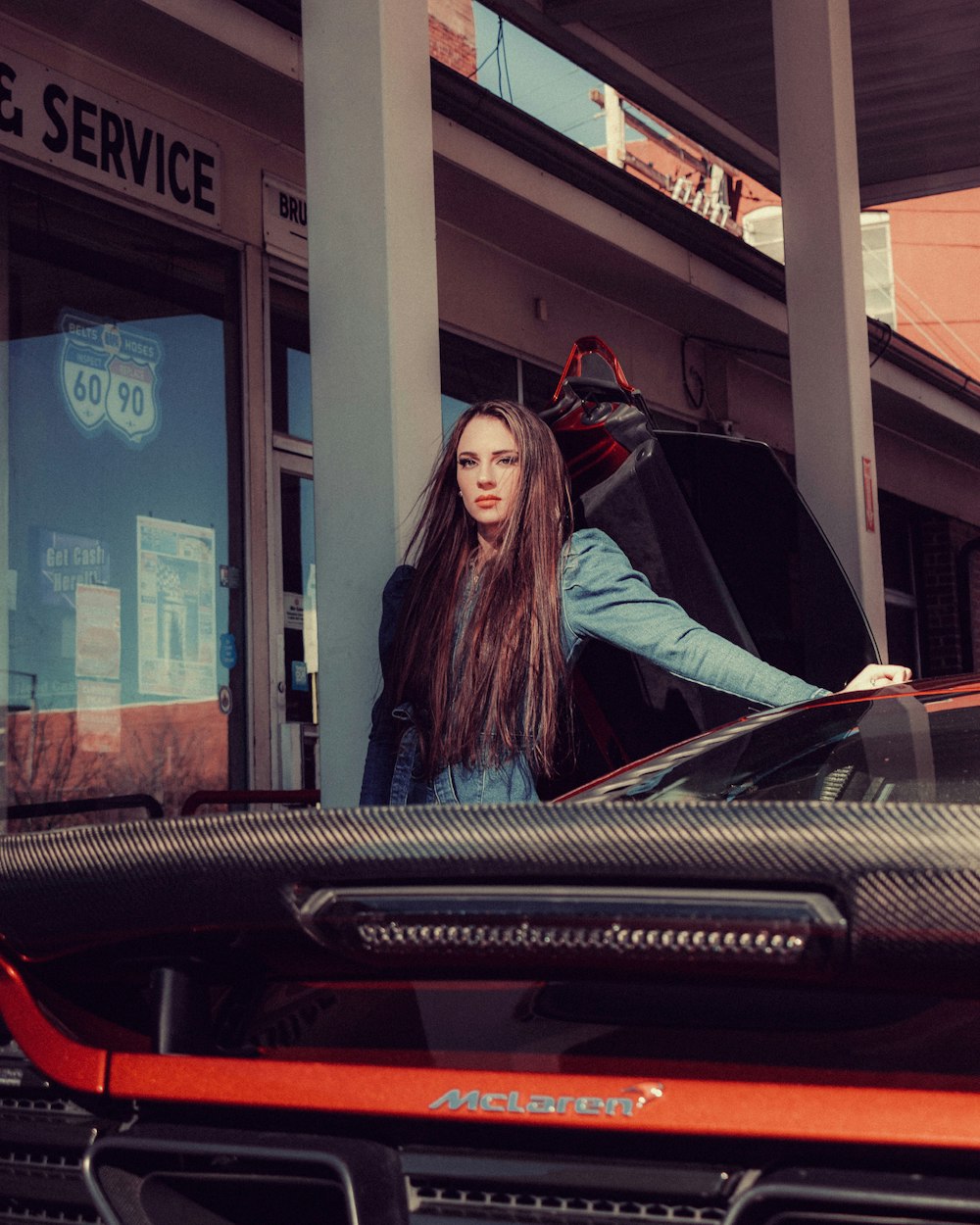 woman in black long sleeve shirt sitting on train station