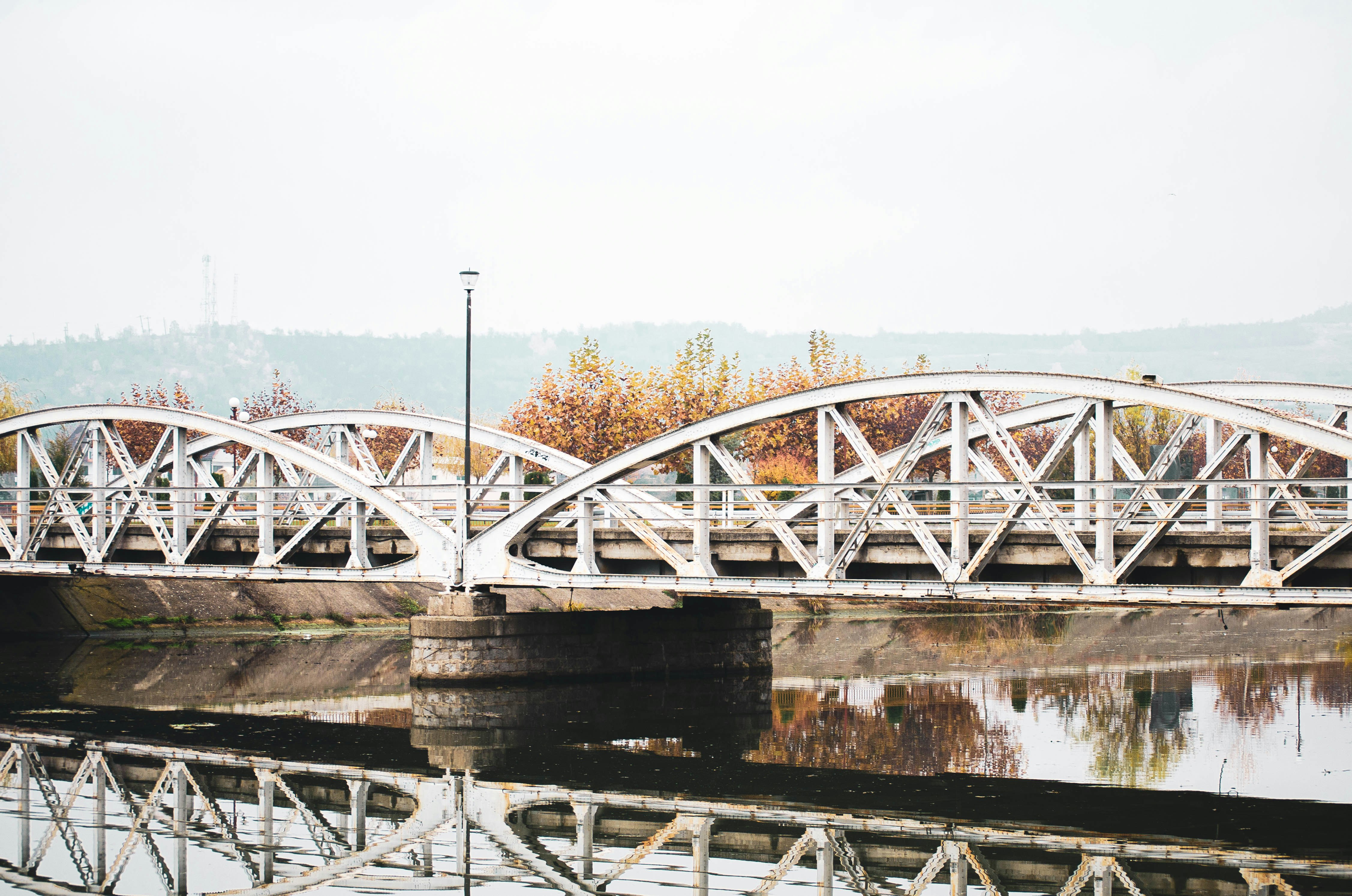 white and brown bridge over river