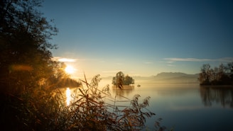 A beautiful sunrise over a calm lake, symbolizing hope.