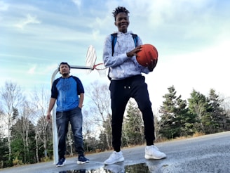 A mentor and mentee sharing a moment of encouragement off the court