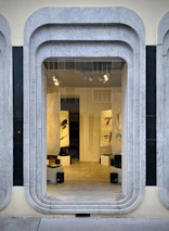 A sleek, minimalist online store homepage showcasing featured artwork.