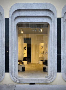 A sleek, minimalist online store homepage showcasing featured artwork.