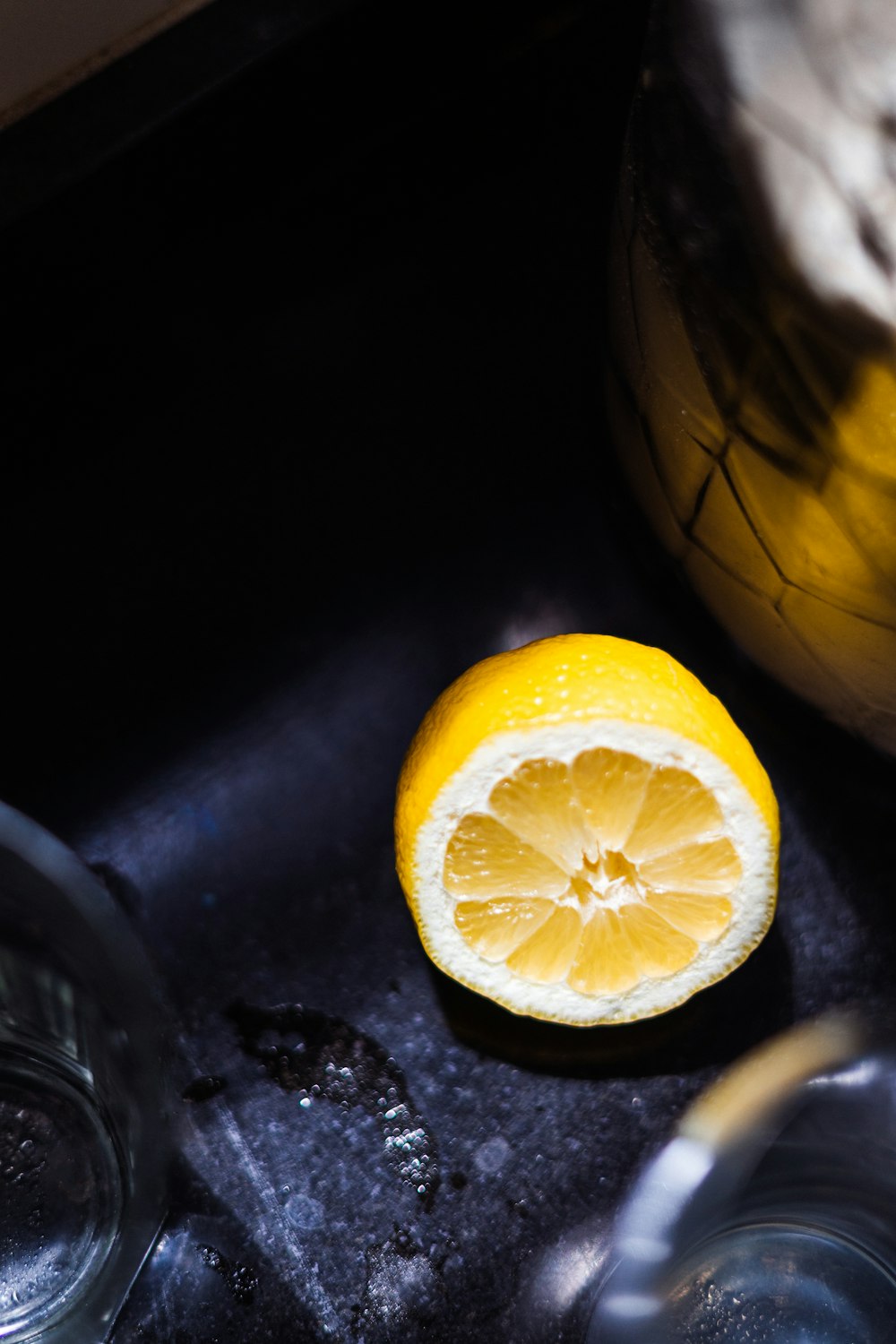 yellow lemon fruit on black table