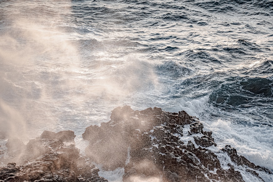 ocean waves crashing on rocks