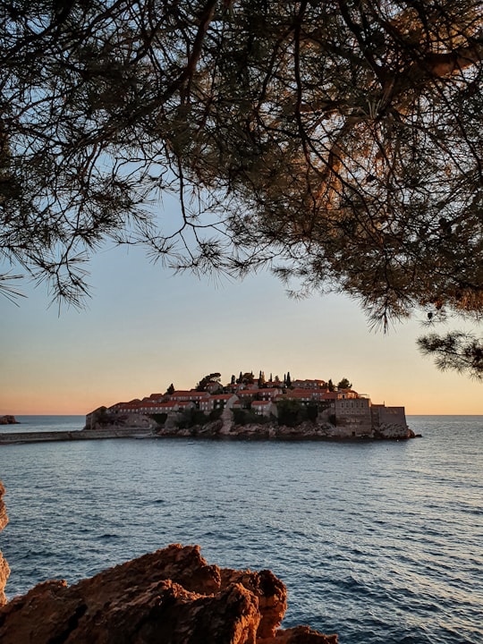 people on beach during sunset in Sveti Stefan Montenegro