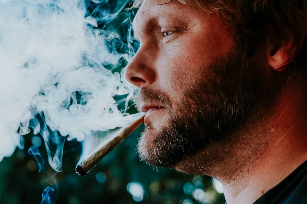 man smoking cigarette during daytime