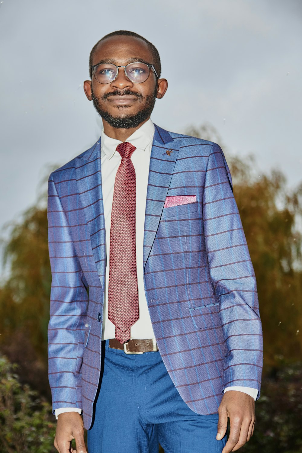 man in blue and white pinstripe suit jacket