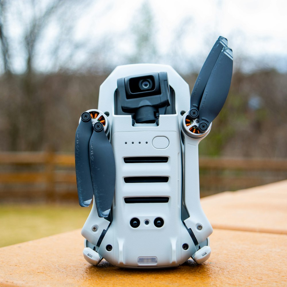 gray robot toy on brown wooden table