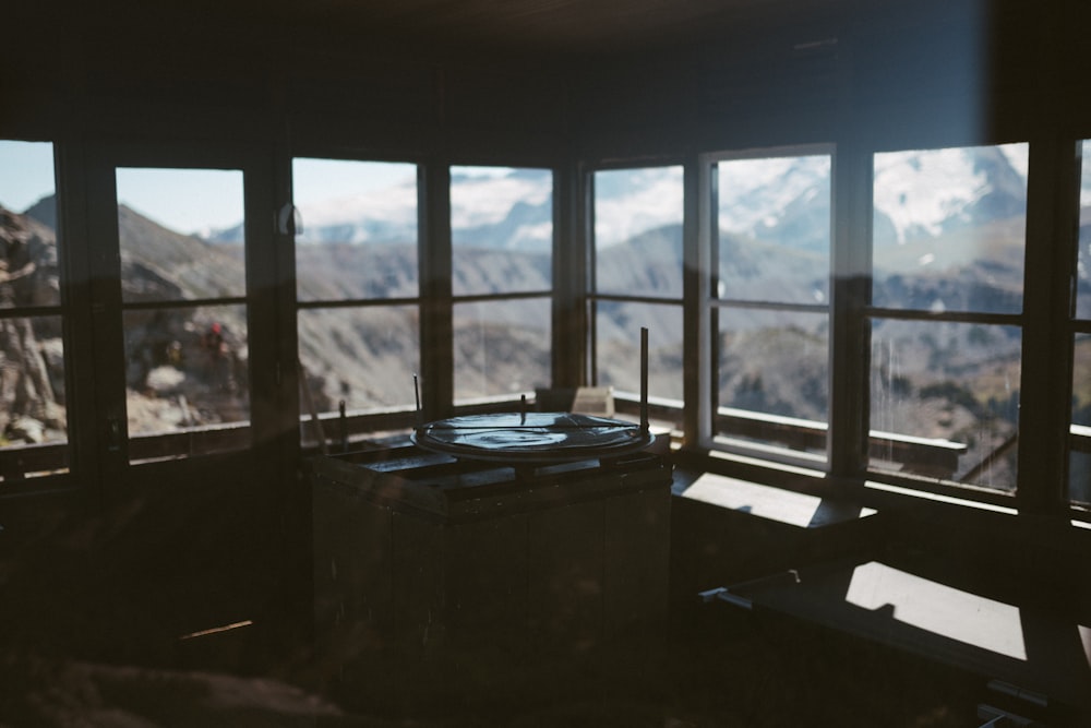 black wooden table near window