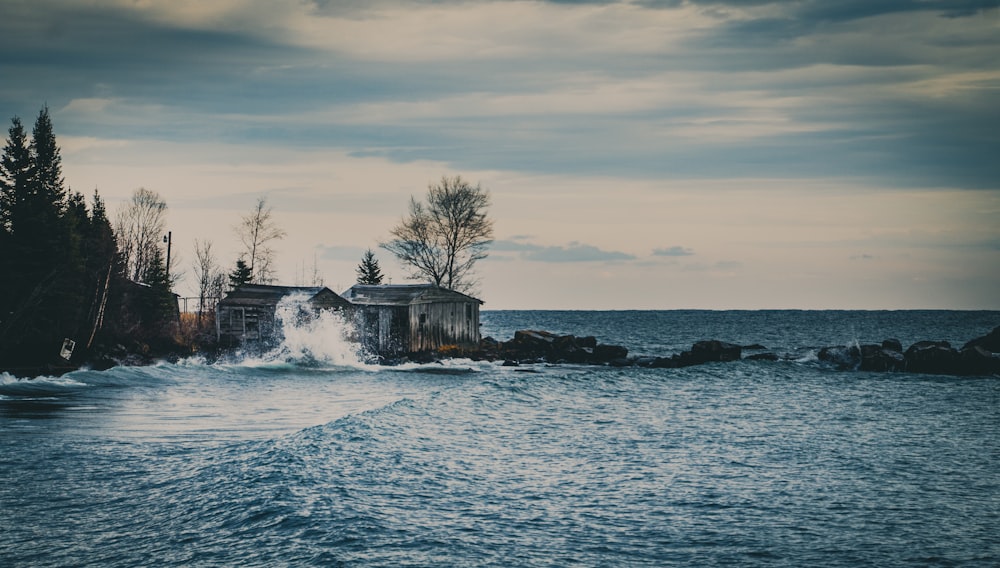 white house on the ocean during daytime