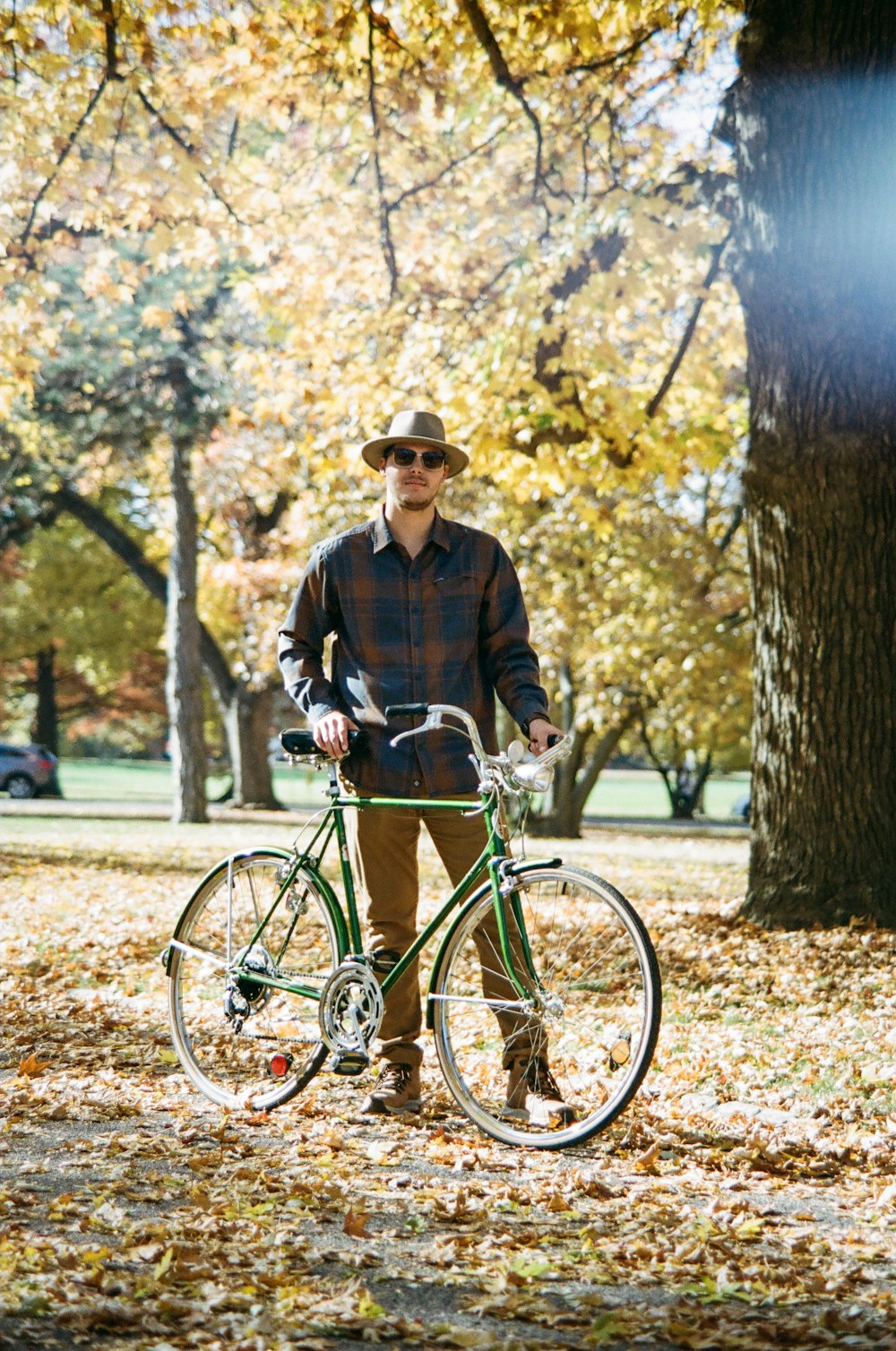 man in black jacket riding on bicycle