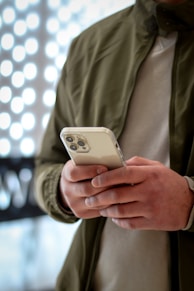 person holding silver iphone 6