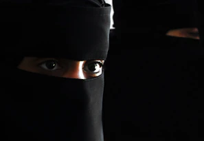 Close-up of expressive eyes and subtle smiles, hinting at deeper stories in the webcomic.