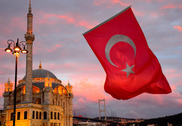 Turkish flag flying above a stone building