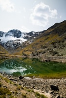 Thumbnail of a serene mountain lake reflecting the sky.