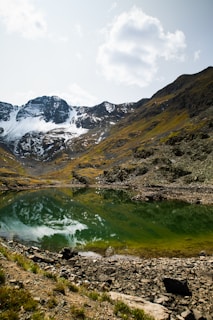 Thumbnail of a serene mountain lake reflecting the sky.