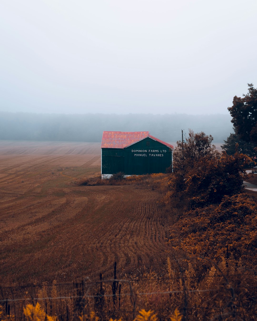 red barn house on brown field during daytime