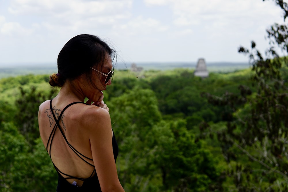 woman in black brassiere and black sunglasses