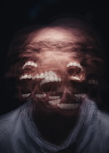 mans face with white scarf