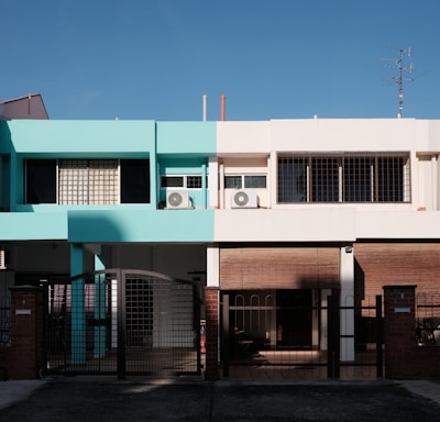 green and white concrete building under blue sky during daytime