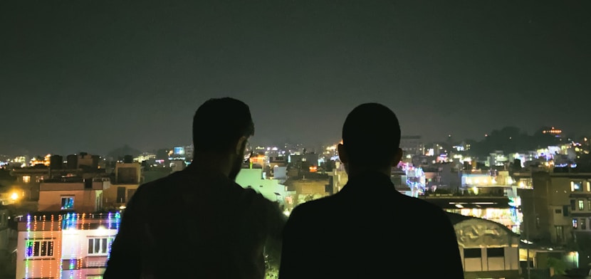 man in black jacket standing beside man in black jacket