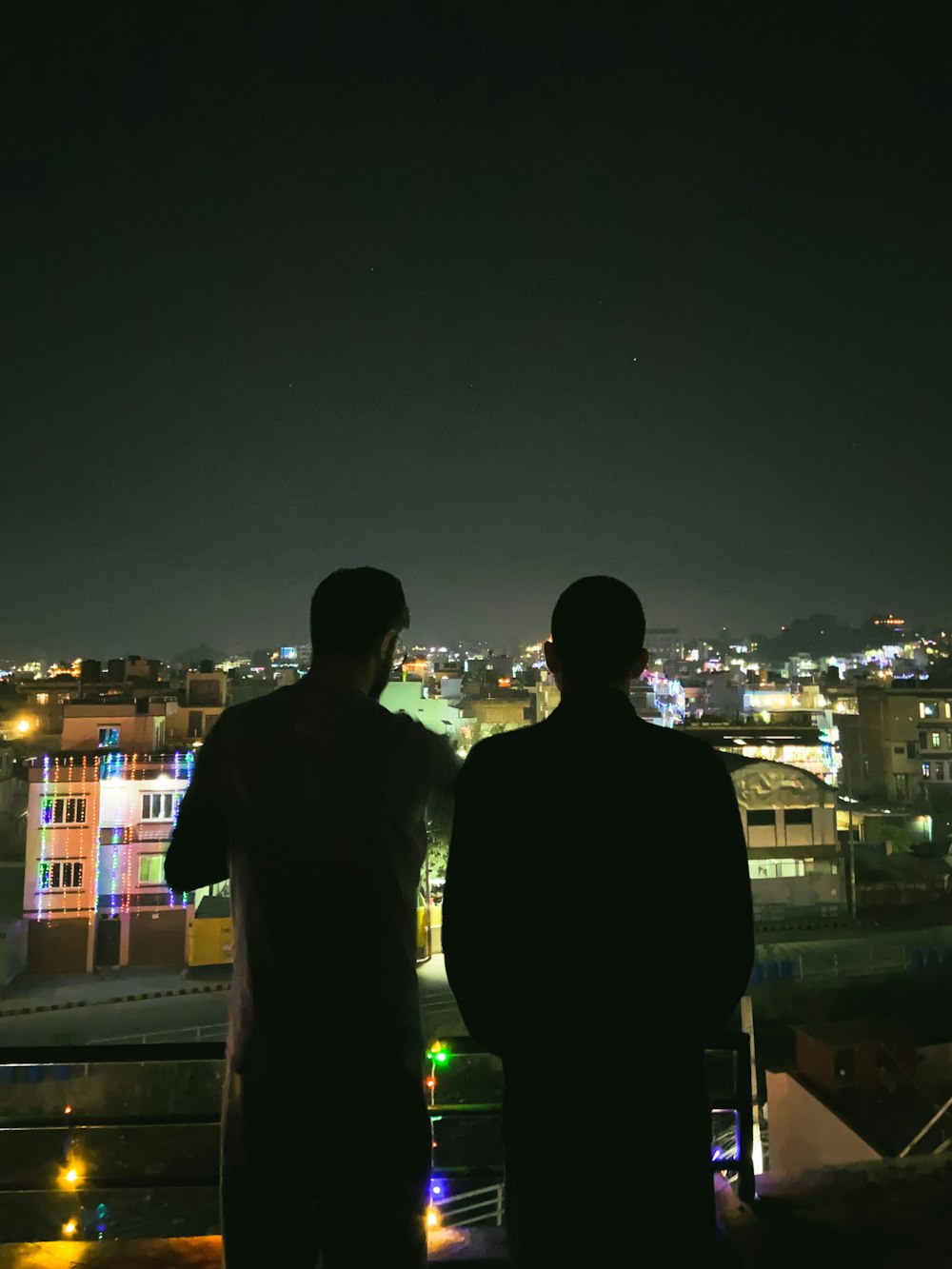 man in black jacket standing beside man in black jacket