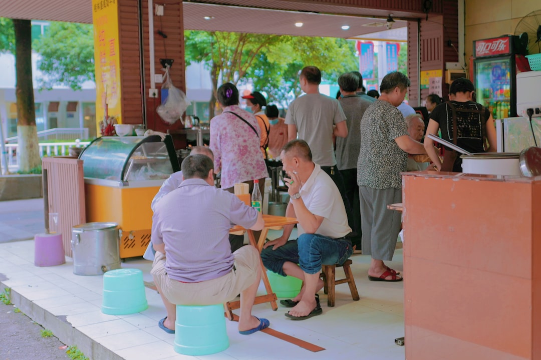 people sitting on orange and blue chairs