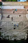 people walking on gray concrete stairs during daytime