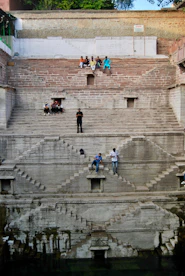 people walking on gray concrete stairs during daytime