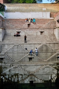 people walking on gray concrete stairs during daytime