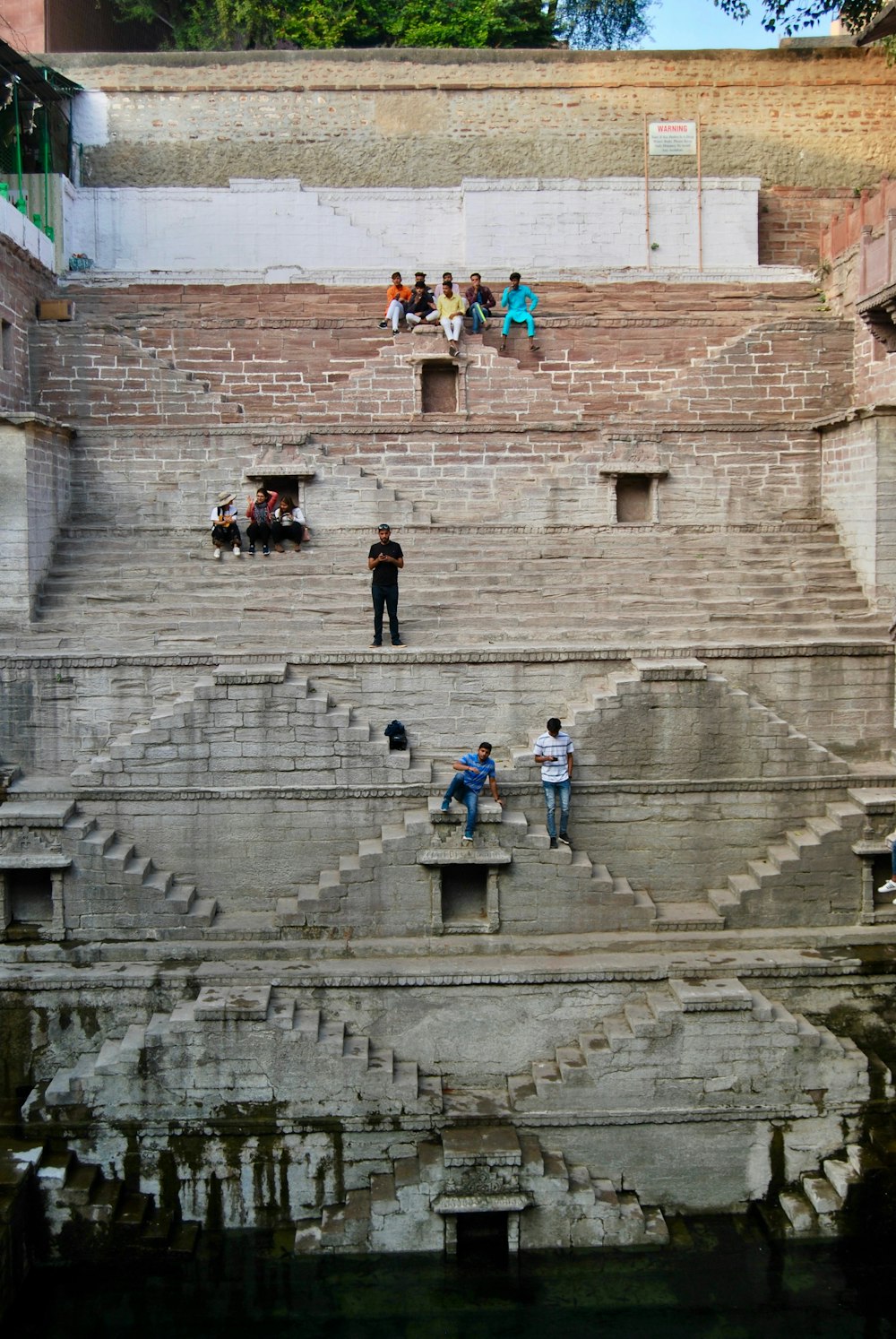 people walking on gray concrete stairs during daytime