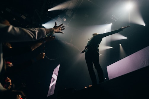 A speaker engaging an audience with enthusiasm.