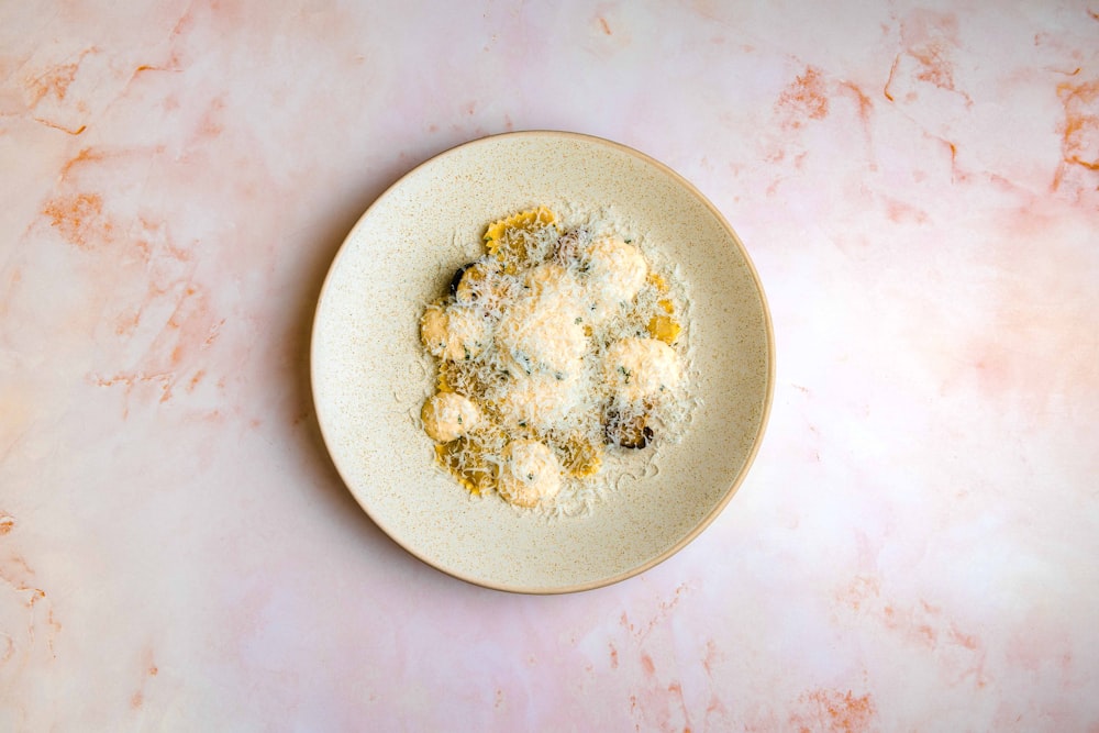 white ceramic plate on white table