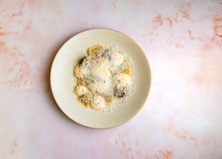 white ceramic plate on white table