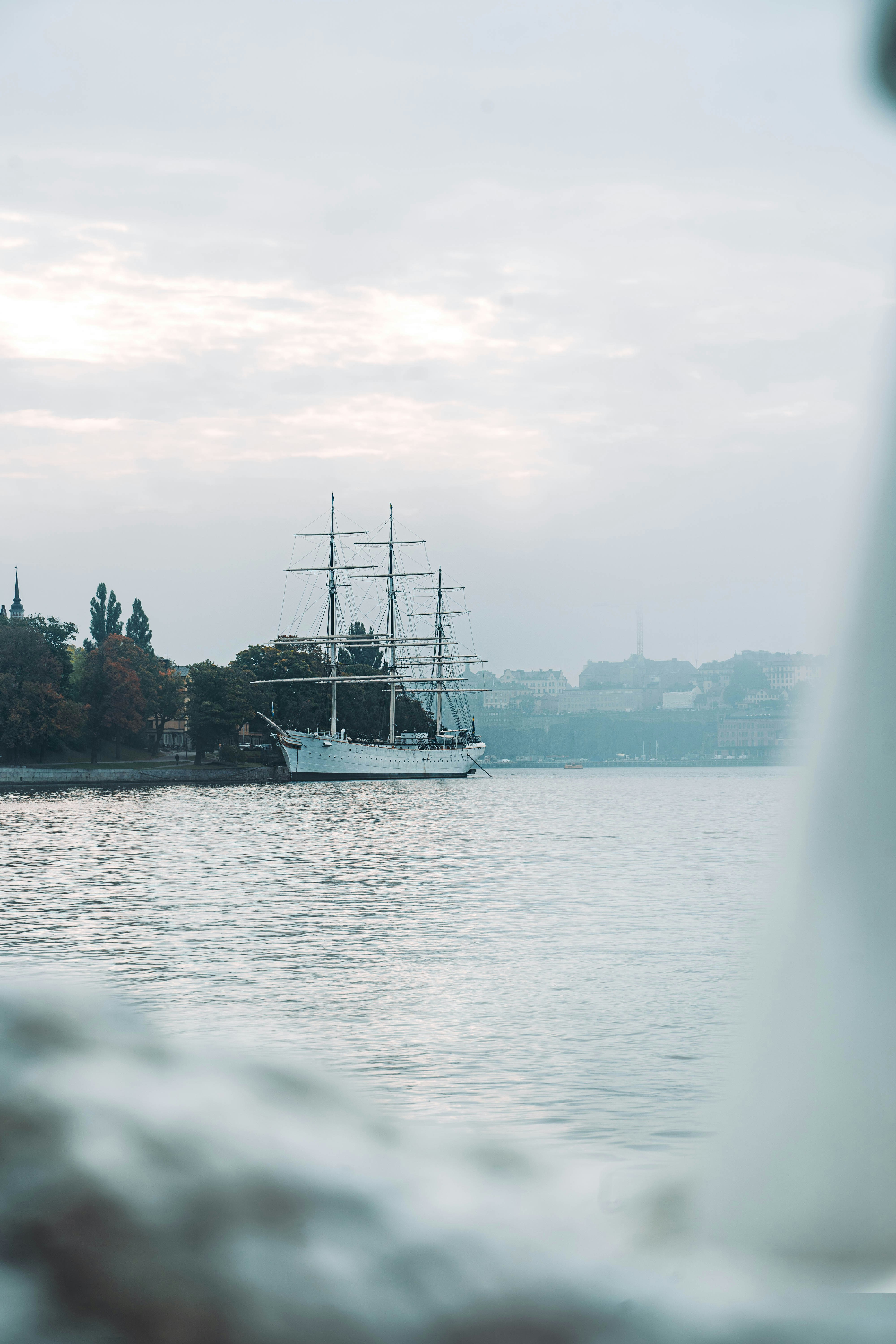 white boat on body of water during daytime
