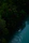 A kayaker paddling through the calm yet lively Kali River surrounded by thick forest and morning mist.