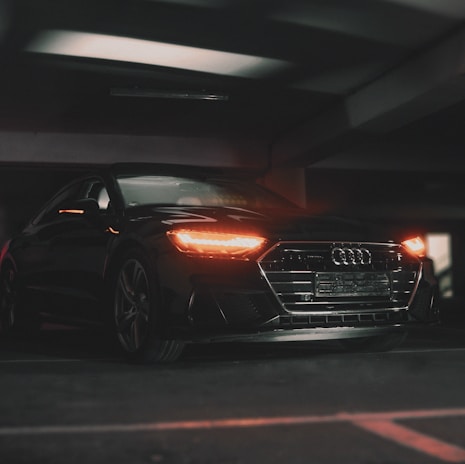 A sleek black vehicle equipped with Helios GPS tracking device installed under the dashboard.