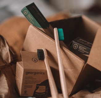 green and white toothbrush on brown carton box