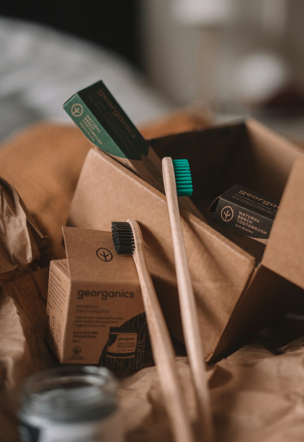 green and white toothbrush on brown carton box