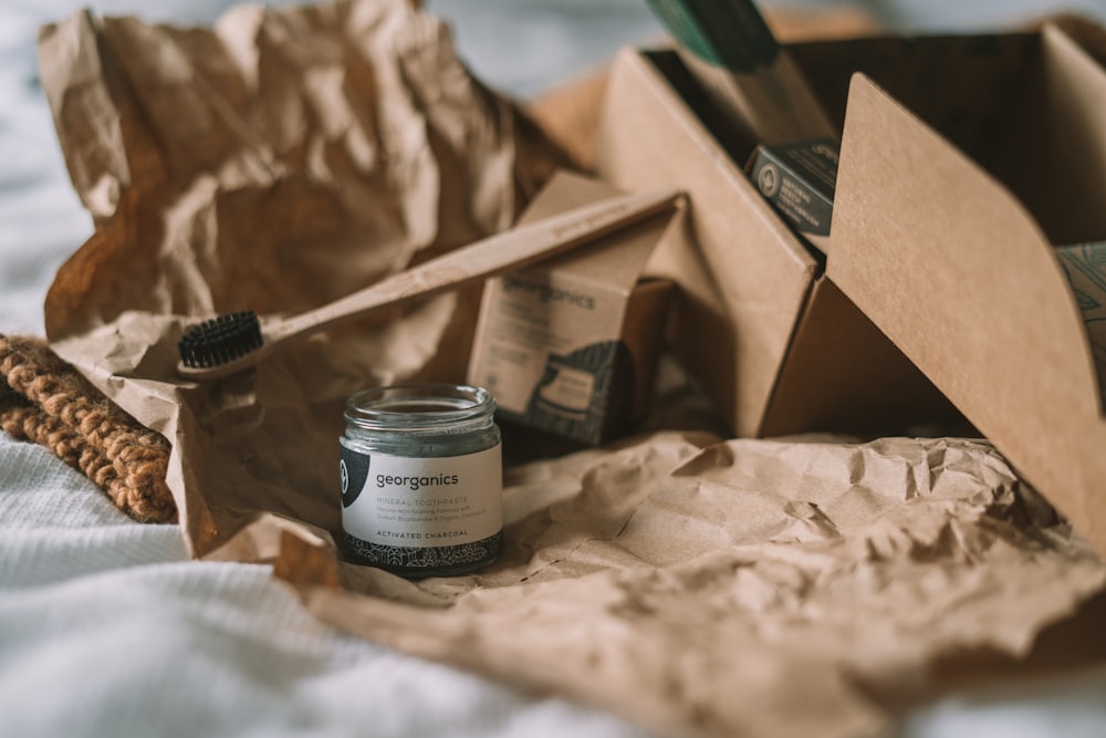 black and silver bottle on brown cardboard box