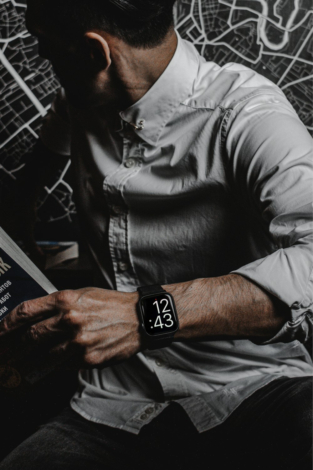 man in gray dress shirt wearing black leather strap silver round analog watch