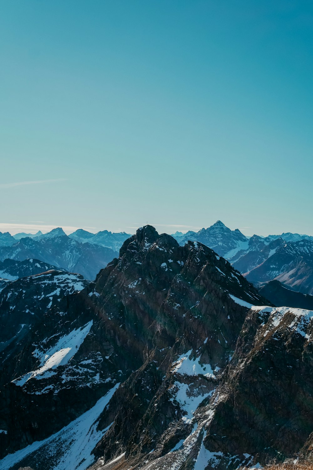 snow covered mountain during daytime