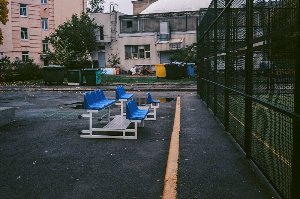 blue and white outdoor lounge chairs on gray concrete floor