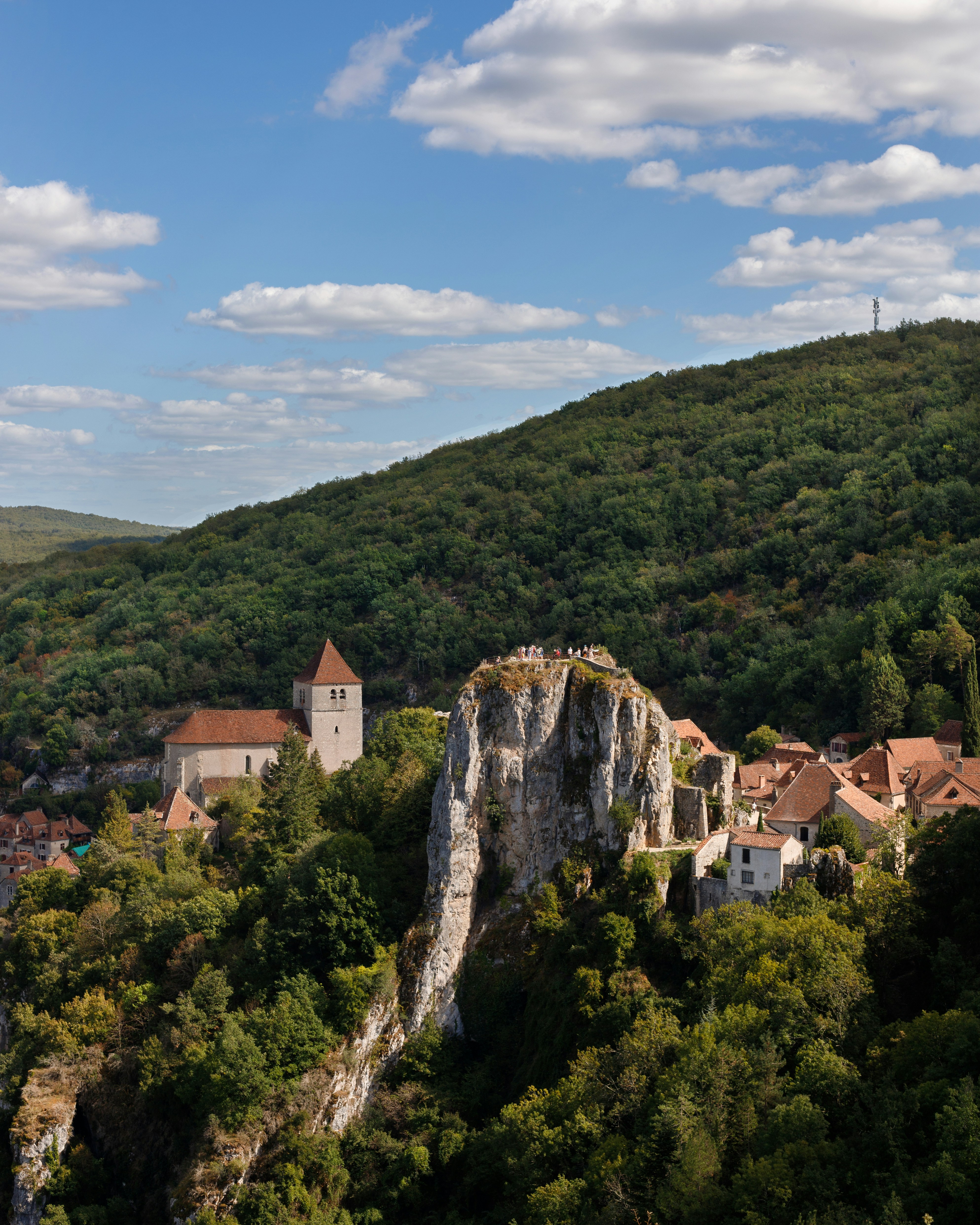white and brown concrete building on top of mountain during daytime