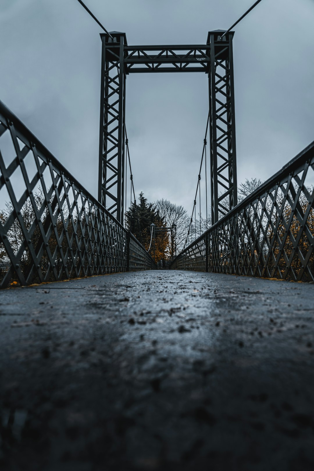 gray metal bridge under white sky during daytime